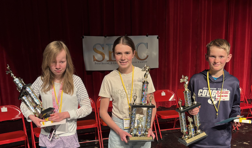 SESC 2025 Regional Spelling Bee Winners holding their trophies