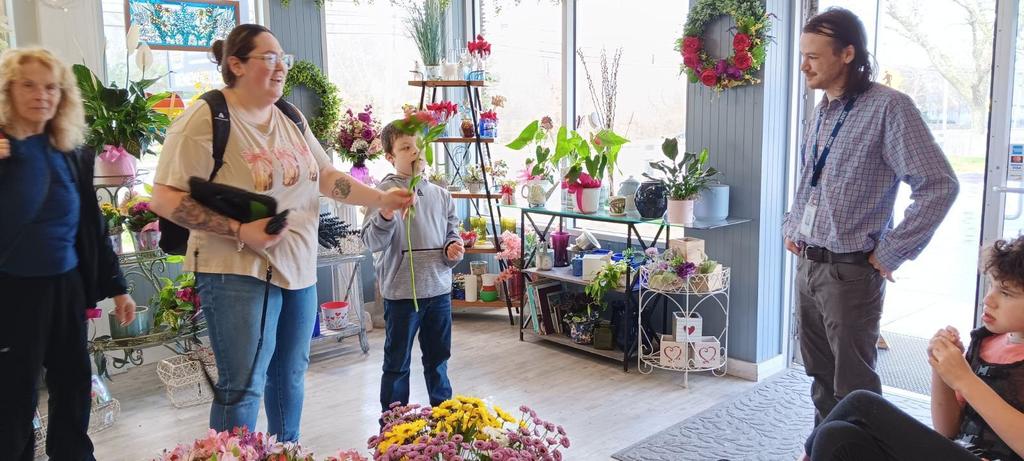 students and teachers shopping in the flower shop 