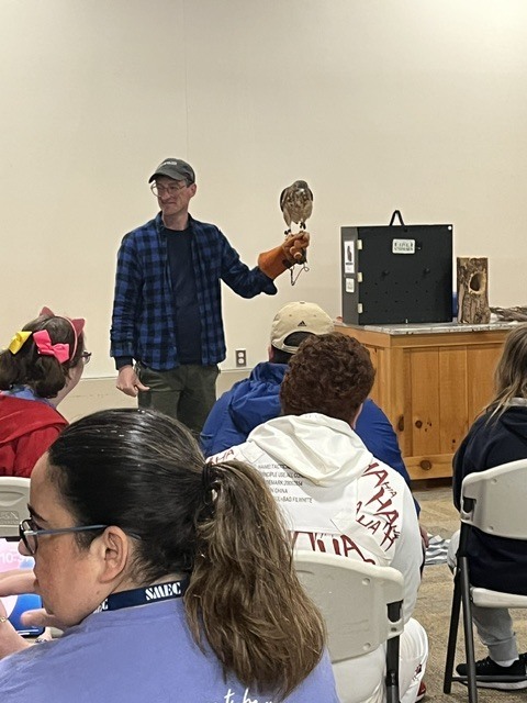 Presenter showing live bird