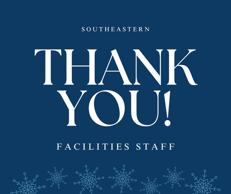 White lettering on dark blue background with small light blue snowflakes along the bottom edge. The message is a thank you to the facilities staff. 