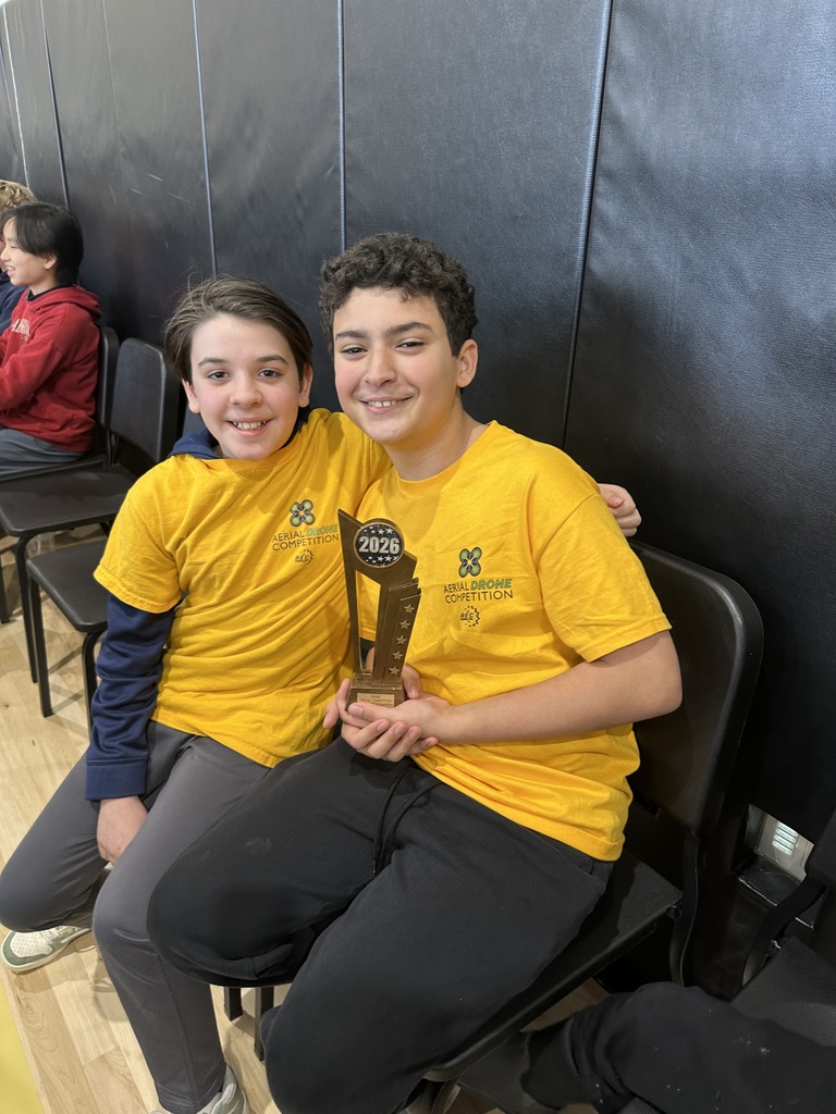 kids smiling with trophy