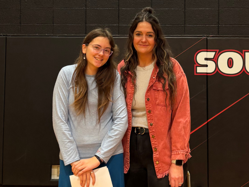 Student with her teacher