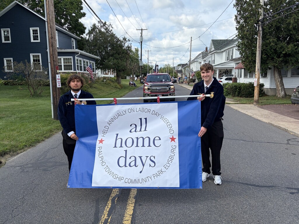 ffa members carrying flag in parade