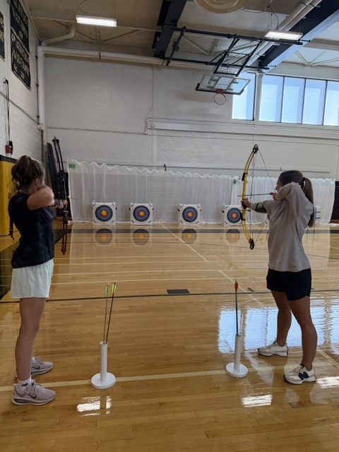 photo of teachers participating in archery training
