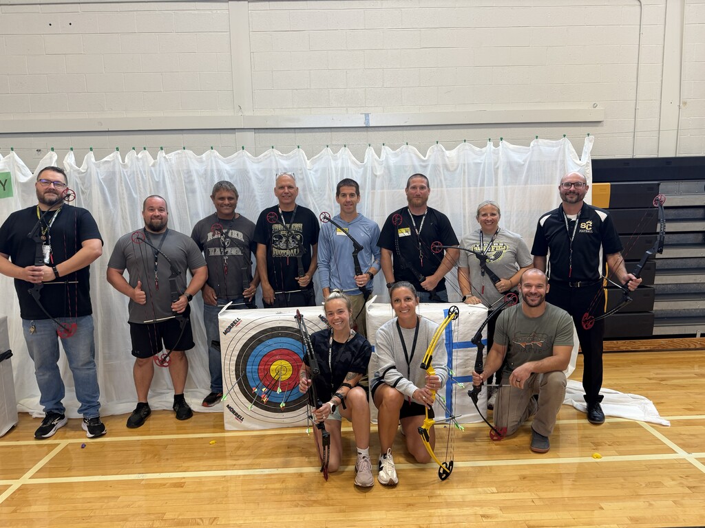 photo of teachers participating in archery training