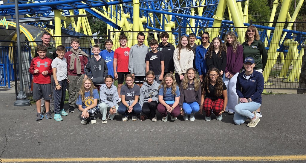 photo of students learning at an amusement park