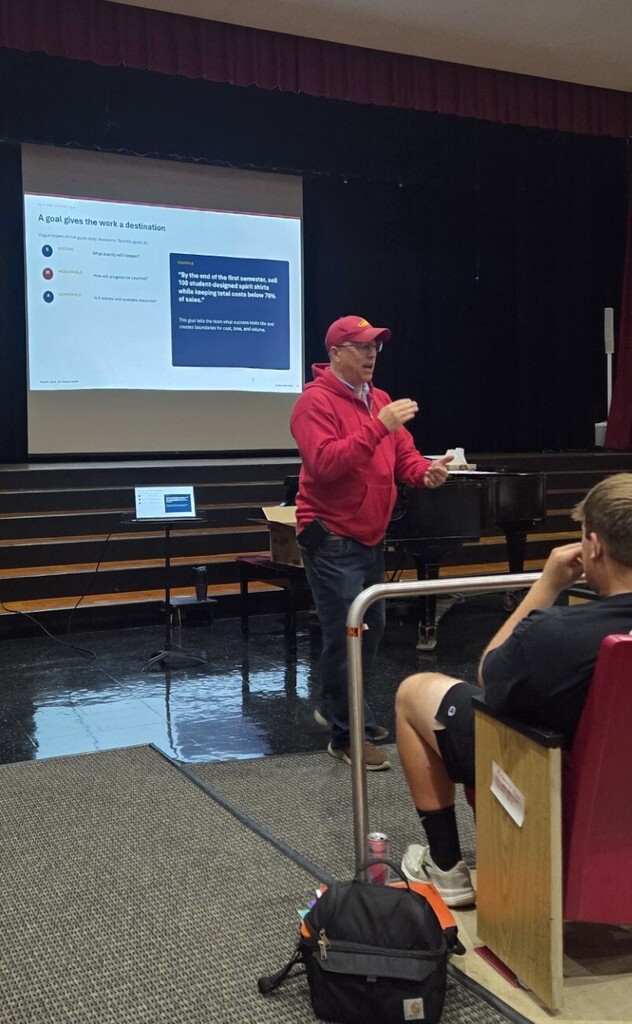 business owner presenting to students
