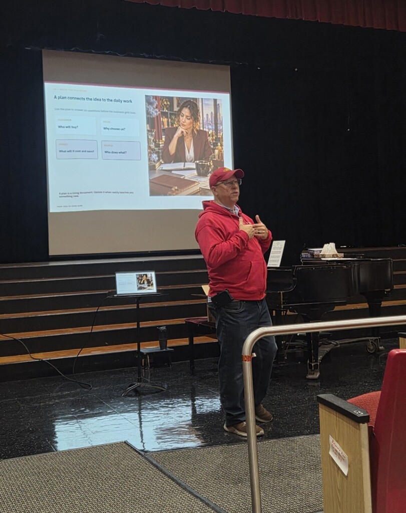 business owner presenting to students
