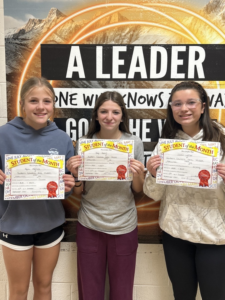 8th grade students of the month holding certificates