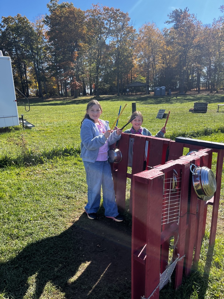 students engaging in activities at a farm market