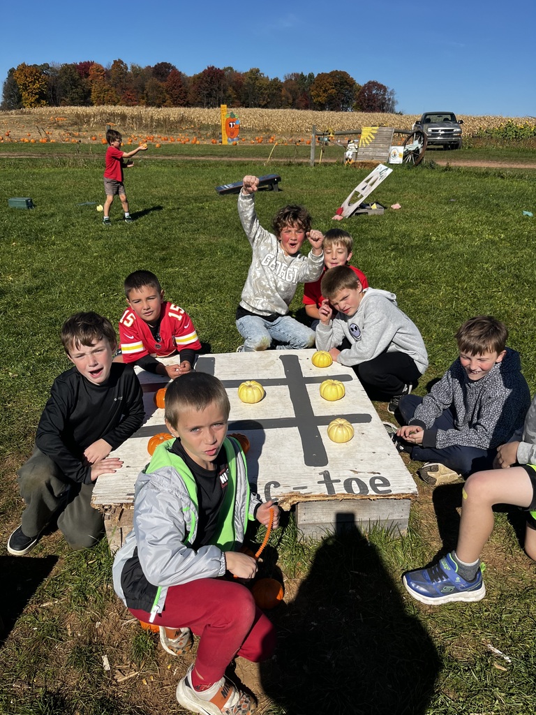 students engaging in activities at a farm market