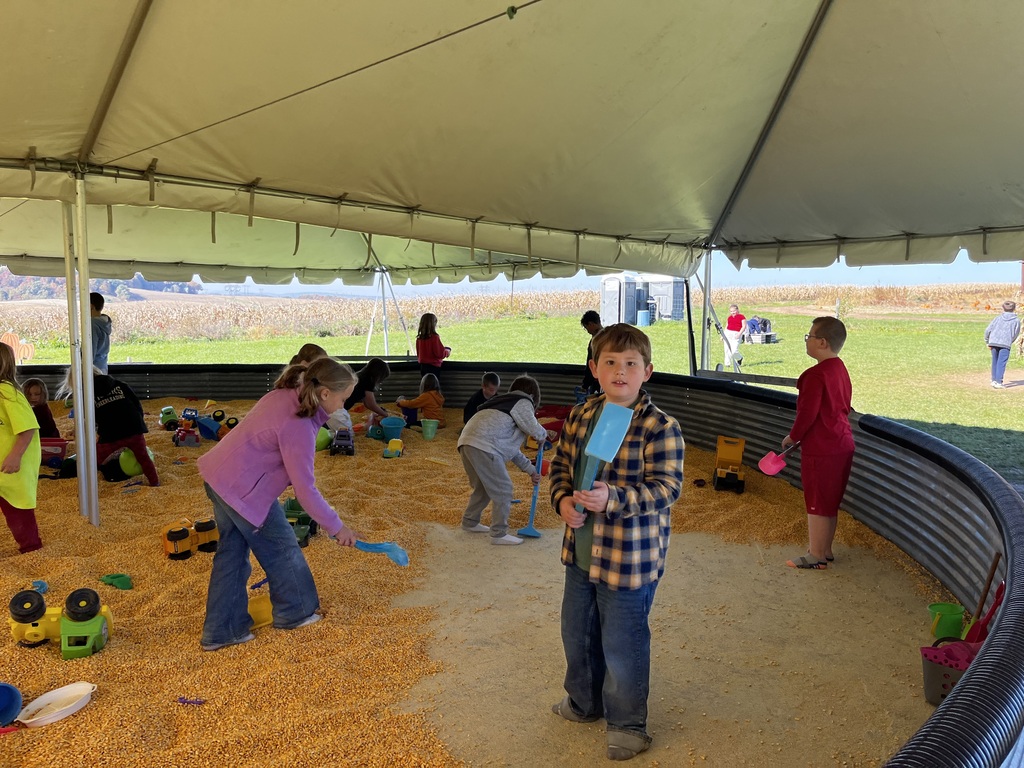 students engaging in activities at a farm market
