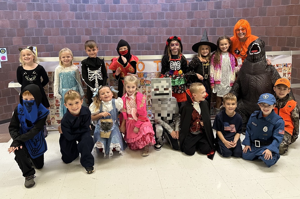 class in costumes posing for a photo