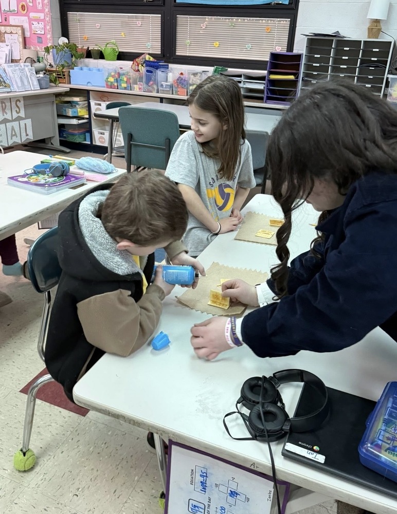 Racine southern FFA members showing 3rd graders how to weld with crackers and cheese.