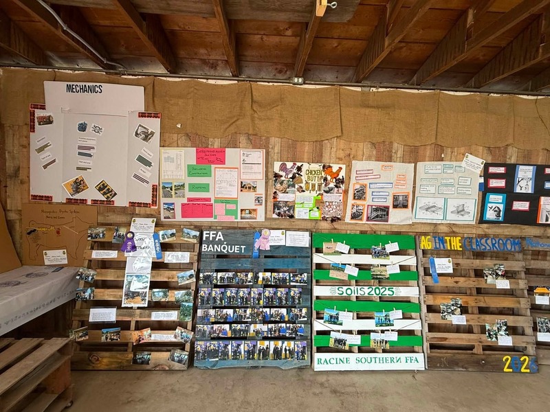 Pictures of are officer pallets displaying events throughout the year along side classroom projects involving animal science, and green house structures.