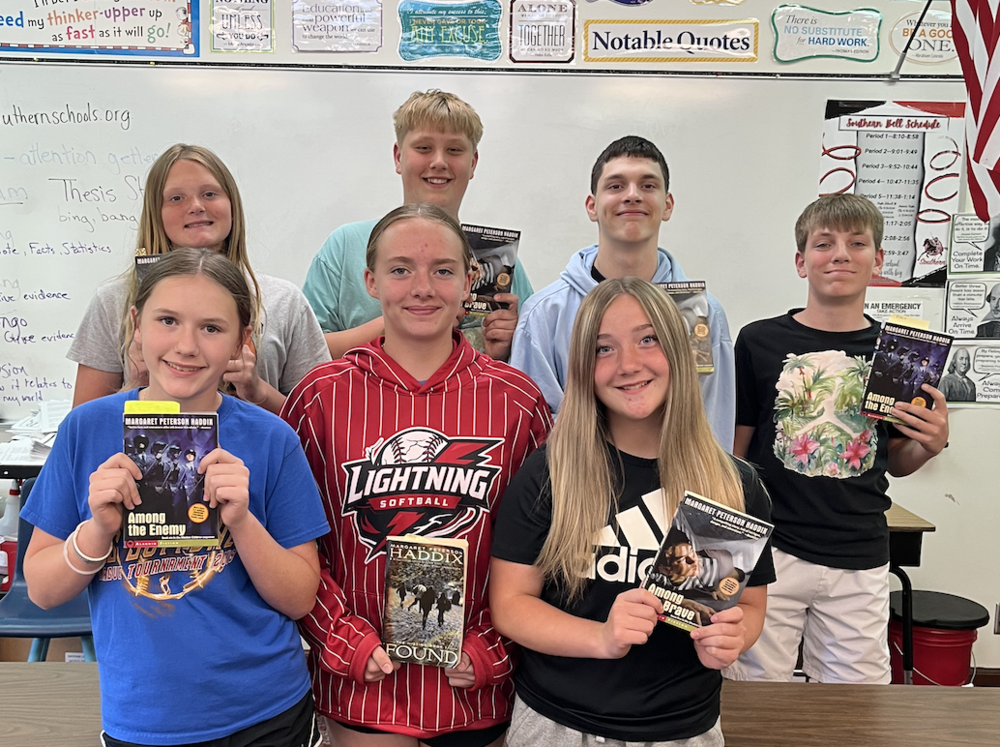 Back row: Sophie Rakes, Maverick Adams, Samual Barton,  Front row: Talon Decker, Ava Schlake, Chezney Pollman stand with their reading books.