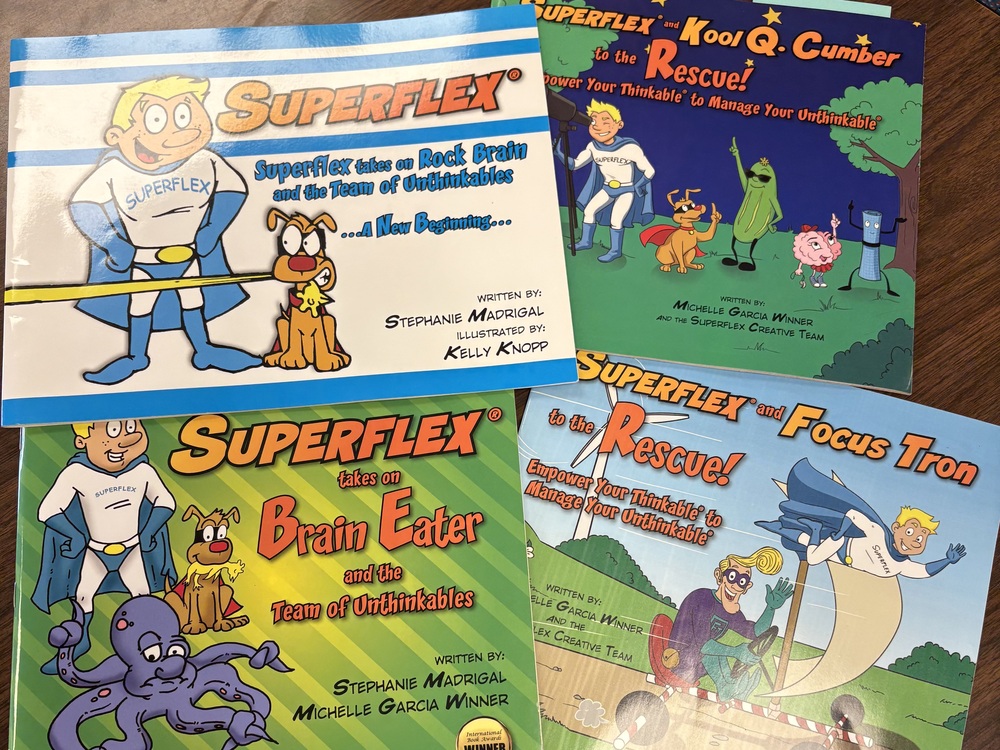Four Superflex books about Superflex, Kool Q. Cumber, Brain Eater, and Focus Tron. 