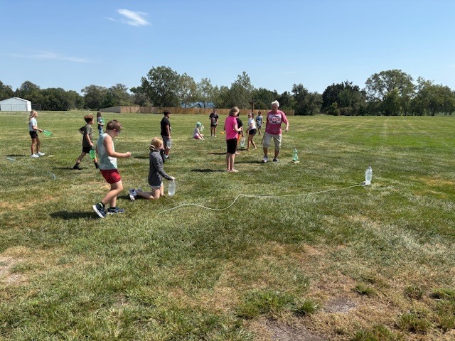 5th grade student launching water rockets
