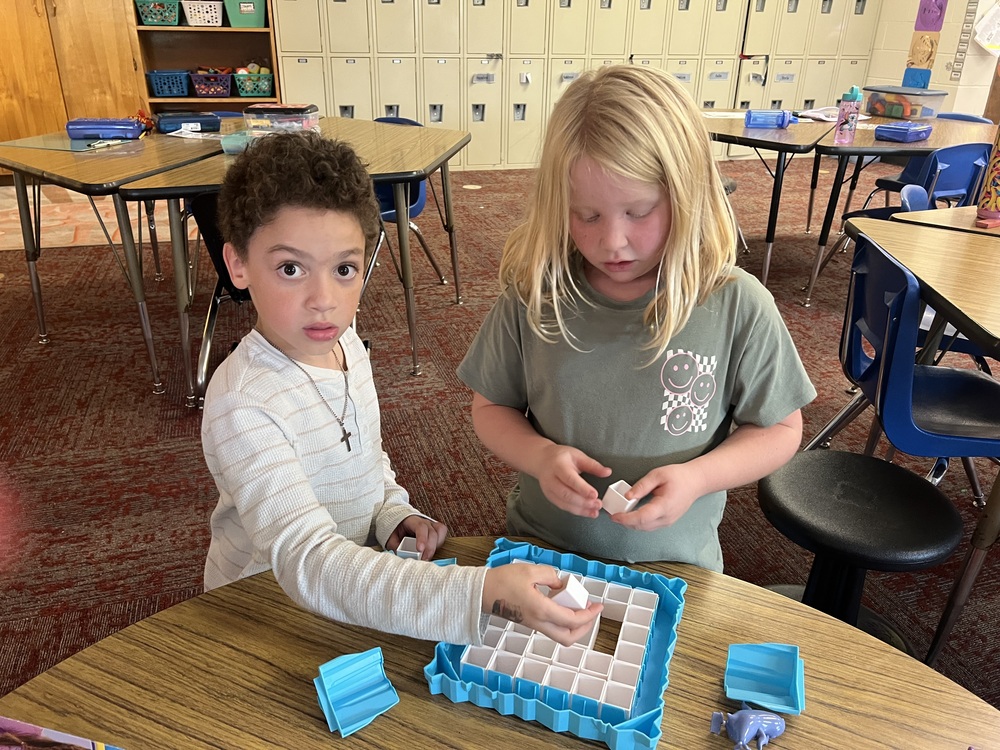 Image of two students playing a game.