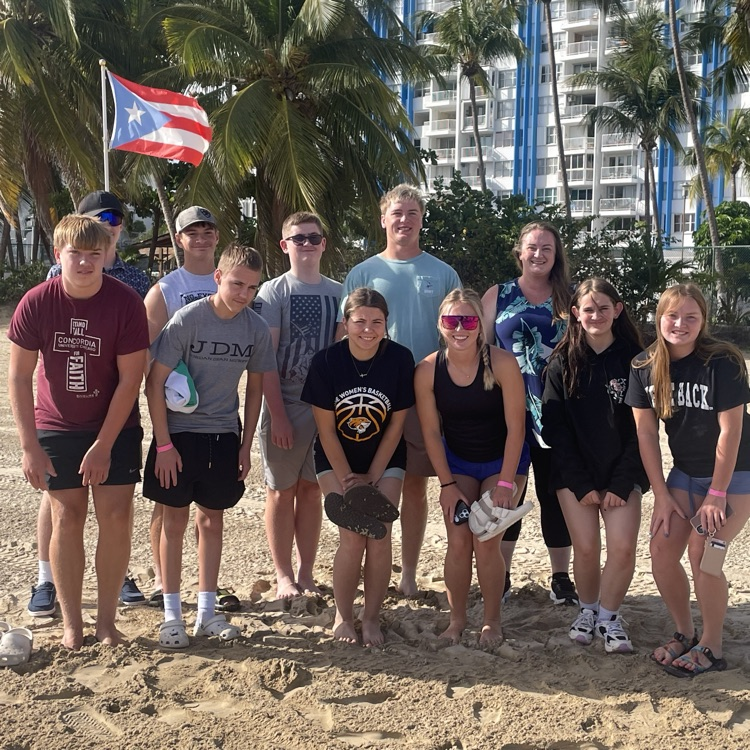 beach oic of kids on trip with the Puerto Rican flag! 