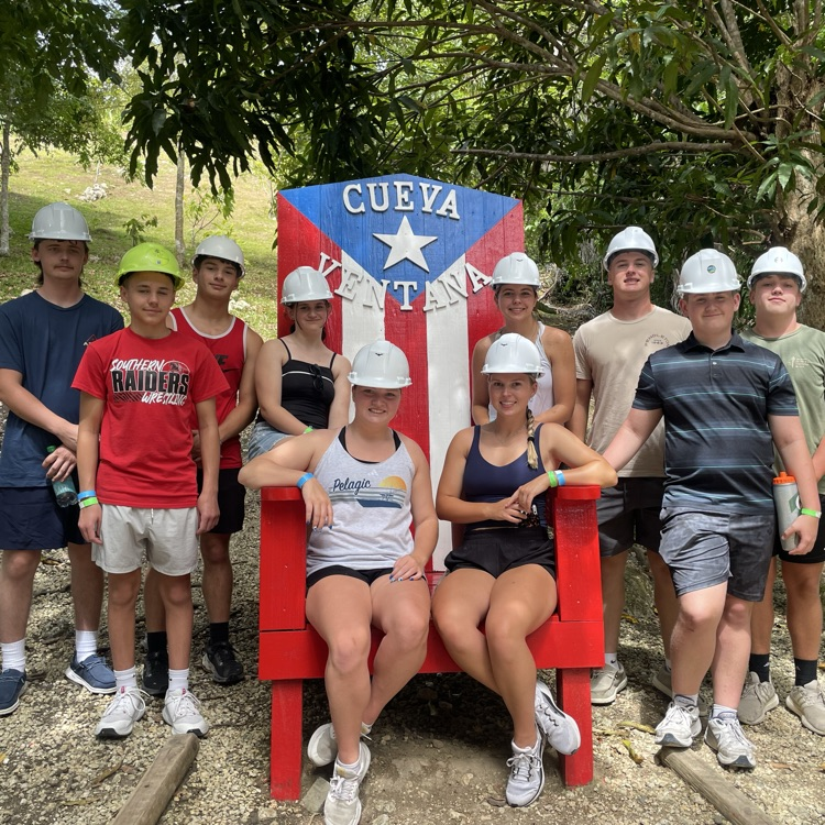 pic of kids in hard hats before caving adventure