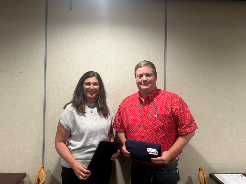 Southern Board of Education members Dana Dorn and Jared McKeever pose with their recognition awards at the Nebraska Association of School Boards Area Meeting in Nebraska City. Dorn received Level V recognition and McKeever received Level II recognition. Debra Schlake, not pictured, also received Level II recognition.