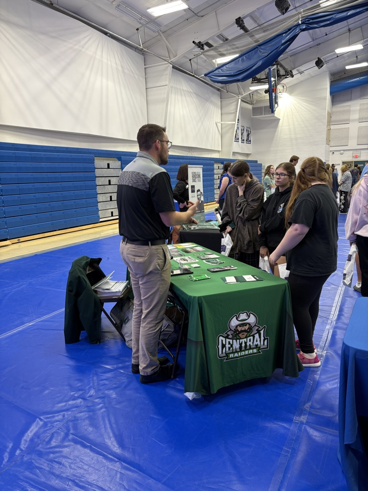 students visiting with college rep
