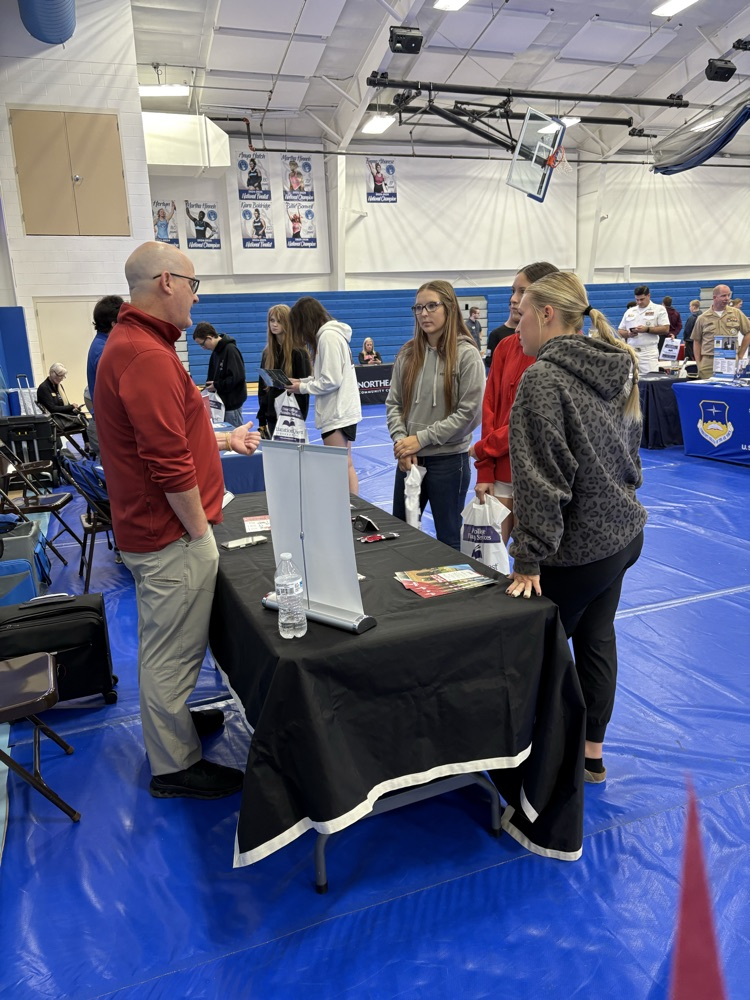 students visiting with college rep
