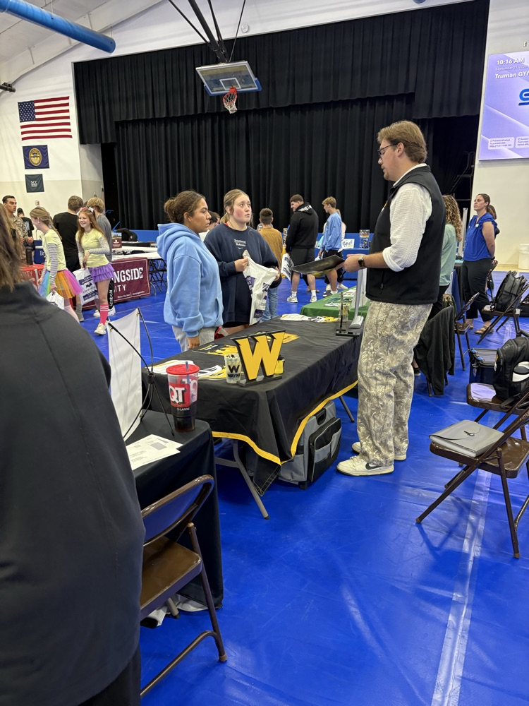 students visiting with college rep