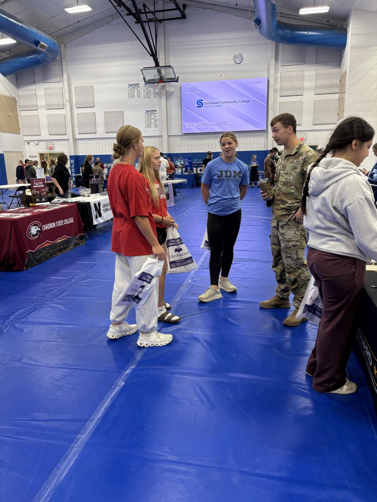 students visiting with college rep