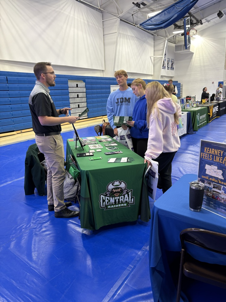 students visiting with college rep
