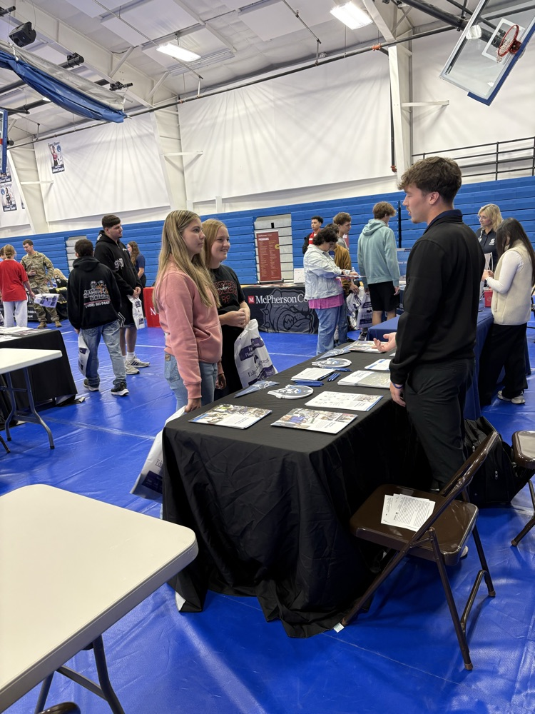 students visiting with college rep