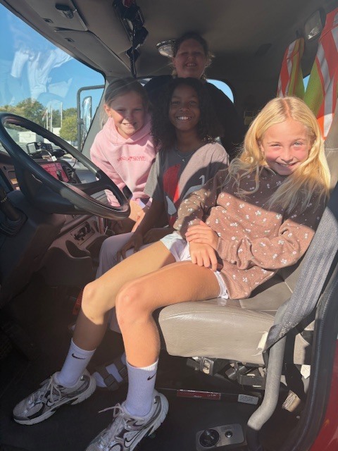 students sitting in the fire truck