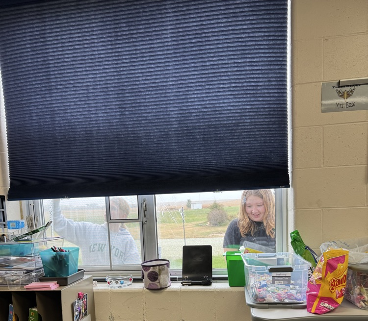 Phoebe and Lillian helping make windows nice and clean.