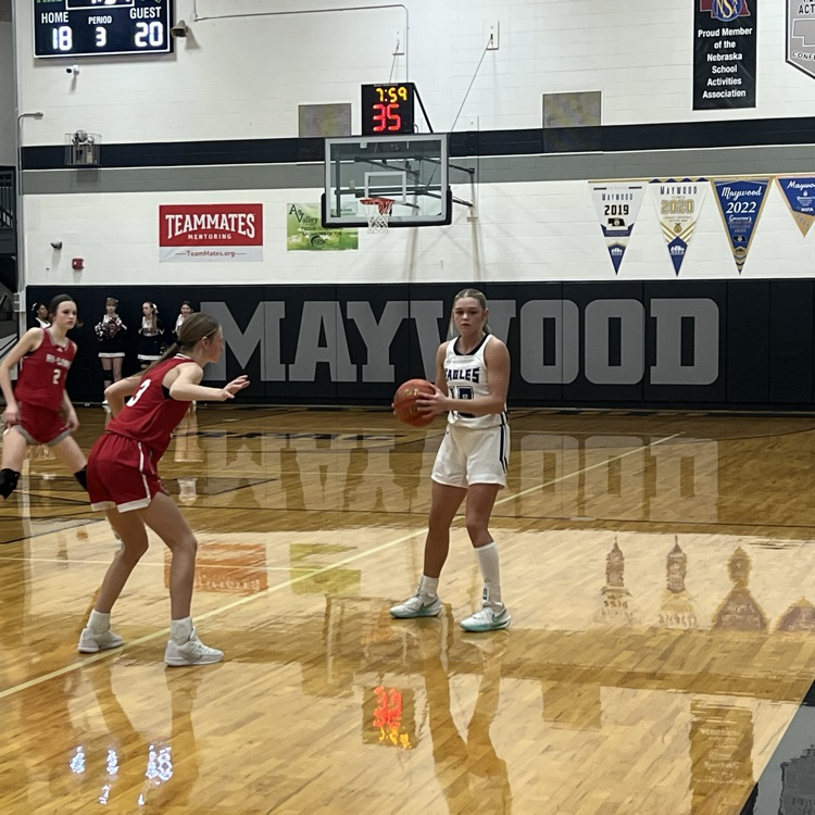 Emercen holds the ball looking for a teammate to pass it to  