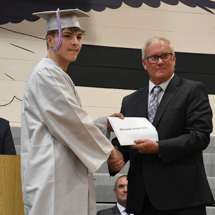 Alex getting his diploma from Board member Steve Hunt