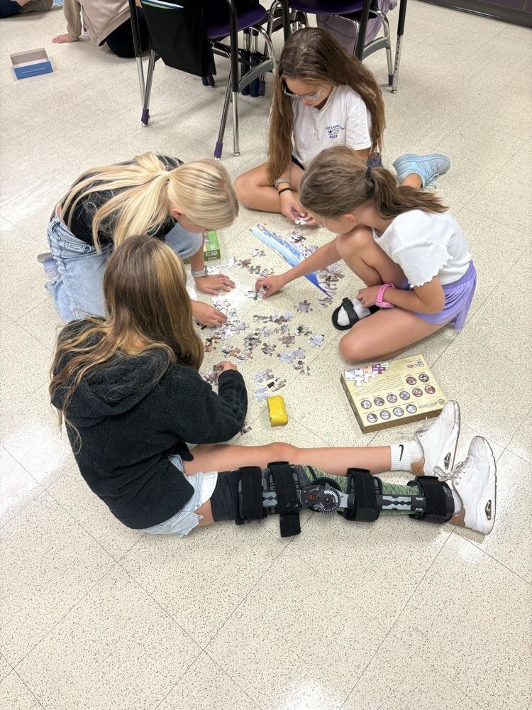 5th grade working to solve their puzzle!
