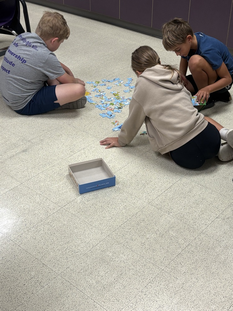 5th grade trying to solve their puzzle!