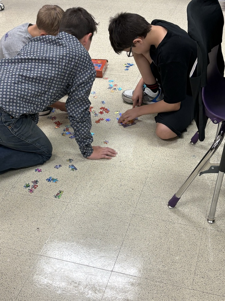 5th grade trying to solve their puzzle!