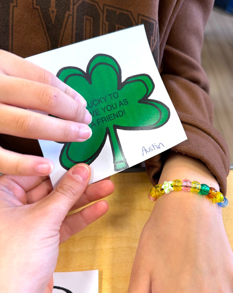 hand points to shamrock craft 