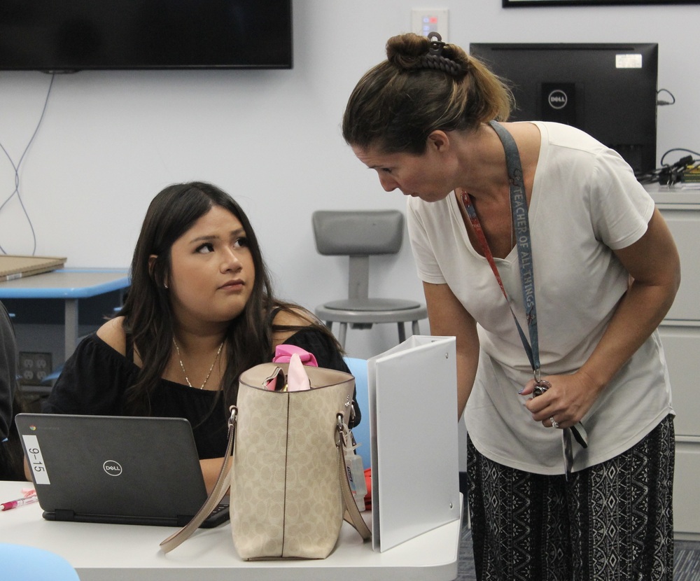 Instructor Ann LoBosco speaks to a student during Pathways in Education, a new program at the Center for Career Services.