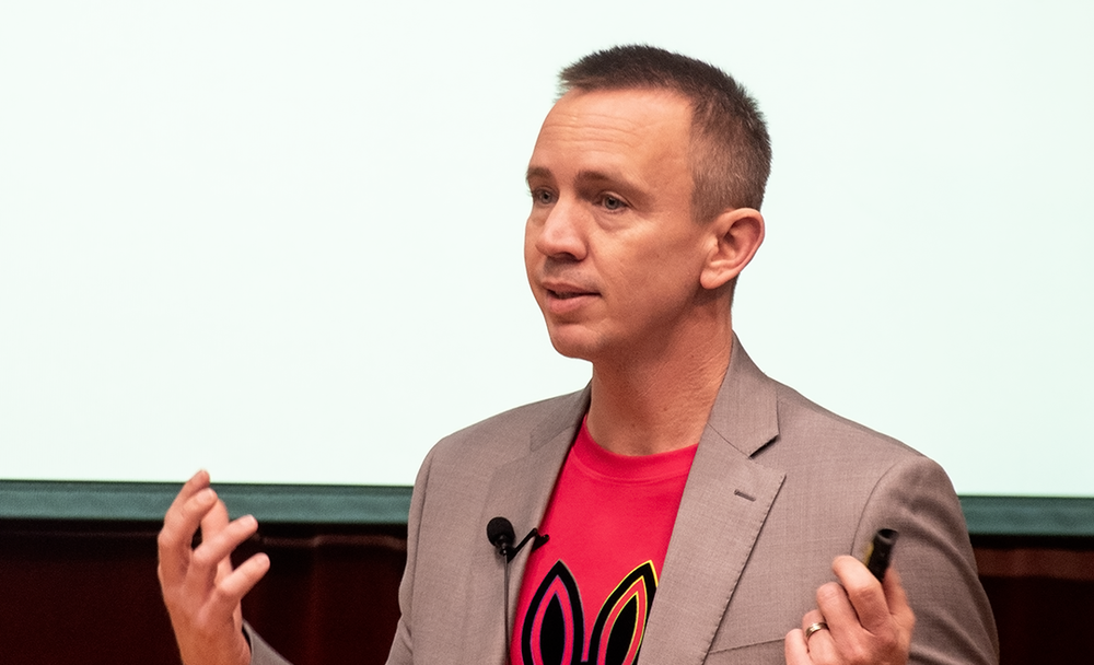Man in red shirt and suit jacket
