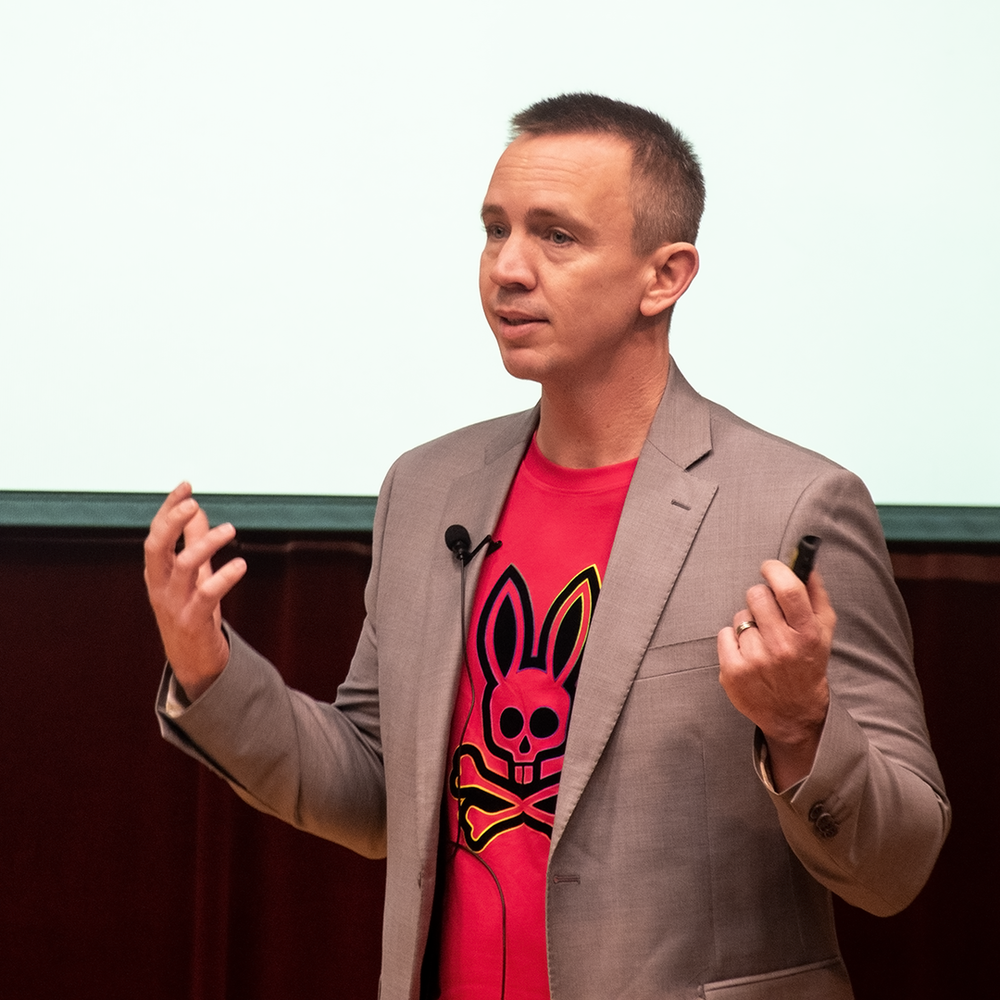 Man in red shirt and suit jacket