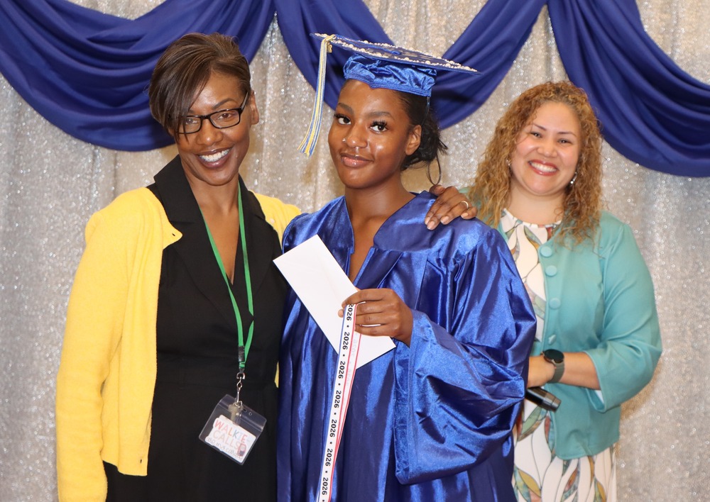 principal, graduate and counselor smiling