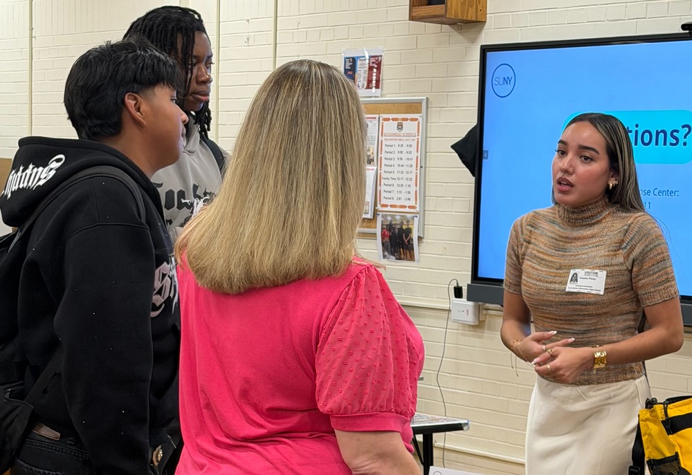college rep talks to students, teachers
