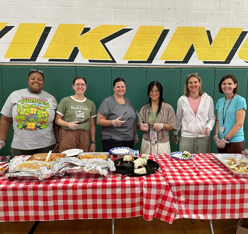 school staff man the buffet table