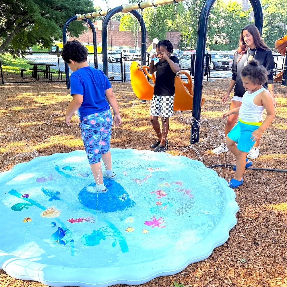 kids play on splash pad