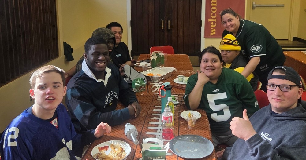 students wear nfl jerseys at school's super bowl party