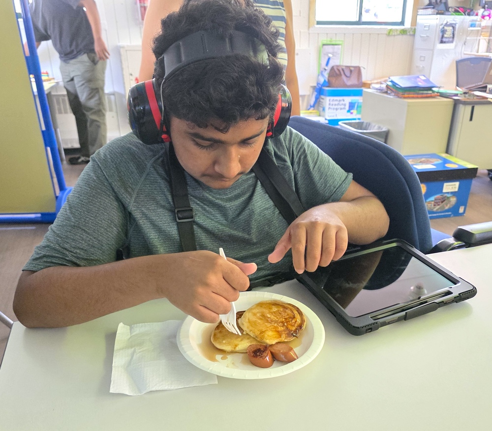 student enjoys breakfast he prepared in life skills room