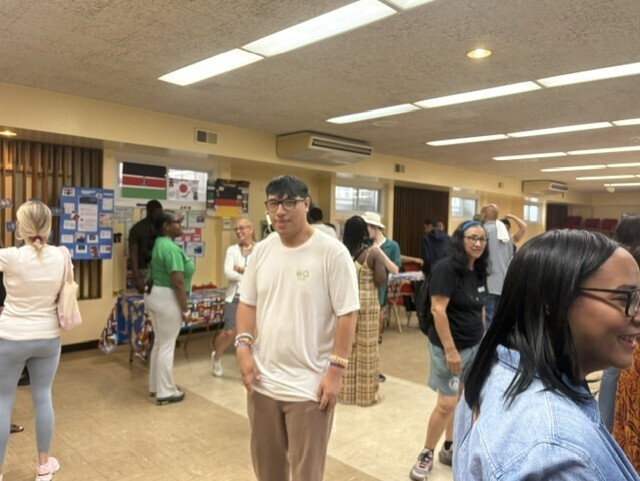 Student showing his mother around